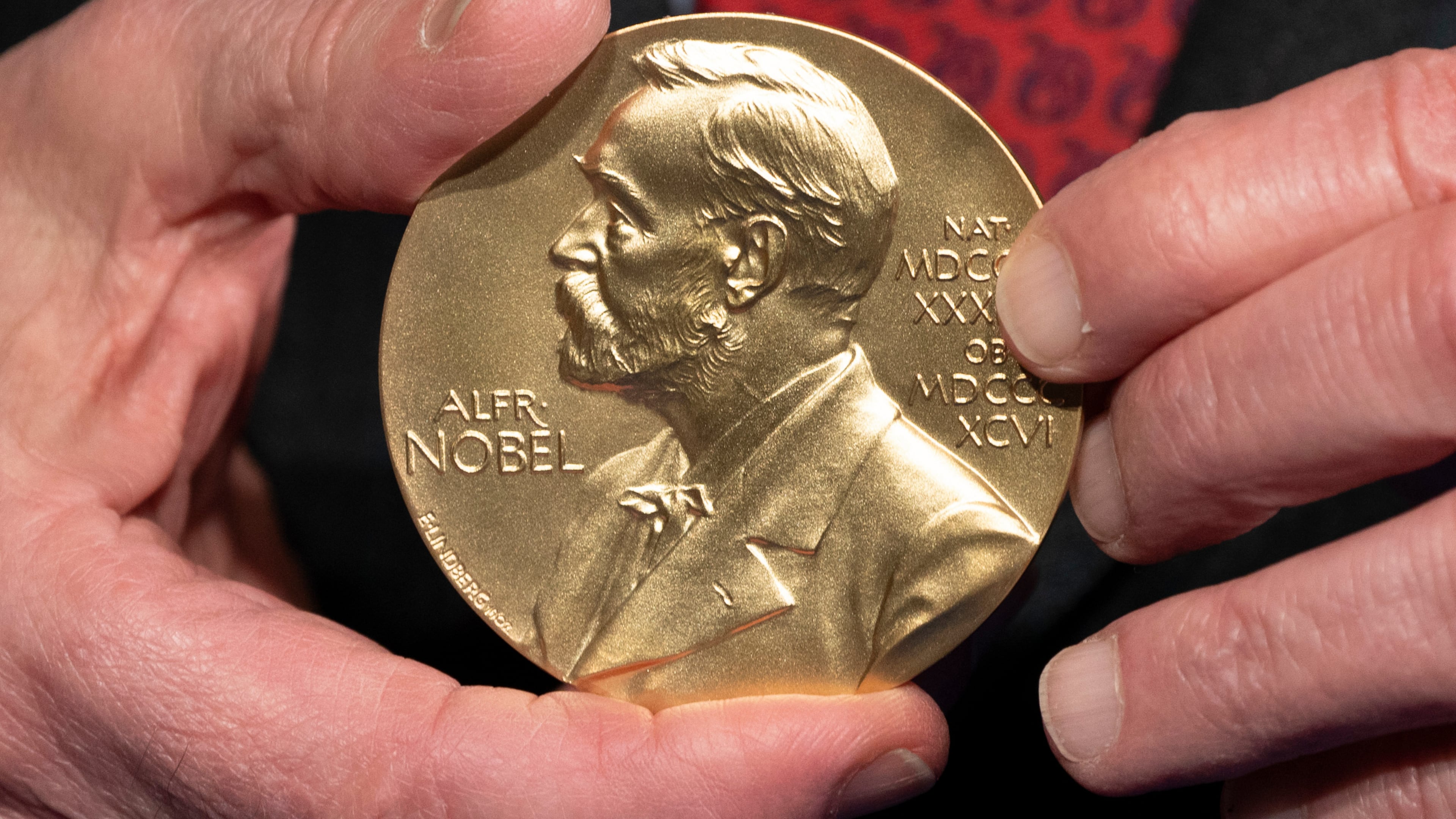 FILE - A close-up view of a Nobel Prize medal at the National Institutes of Health (NIH) in Bethesda, Md., Tuesday, Dec. 8, 2020. (AP Photo/Jacquelyn Martin, File)