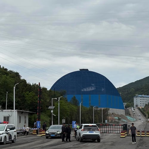 Police officers at a checkpoint stop cars at the entrance to the Liushenyu coal mine facility in Qinyuan county in Changzhi, northern China's Shanxi province on Sunday, May 24, 2026. (AP Photo/E. Eduardo Castillo)