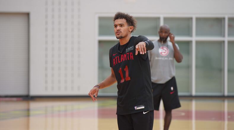 Atlanta guard Trae Young directs a play during team practice Monday, Sept. 28, 2020, in Atlanta. It's ben six-and-a-half months since the team gathered together.