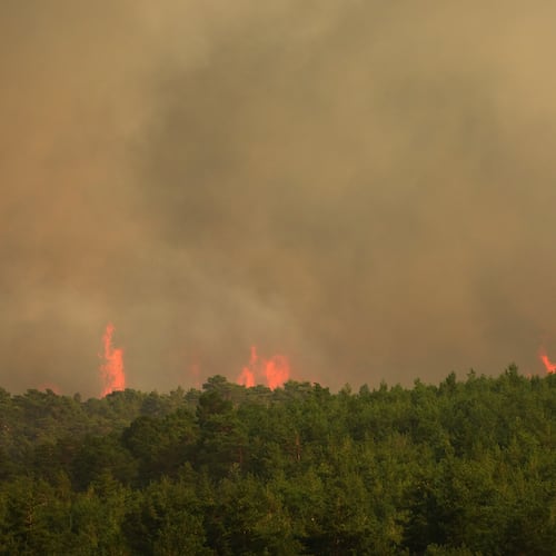 Wildfire advances near Condemios de Arriba, Guadalajara province, Spain, Wednesday, July 22, 2026, after a wildfire scorched tens of thousands of hectares in one of Spain's largest wildfires in recent years. (AP Photo/Manu Fernandez)