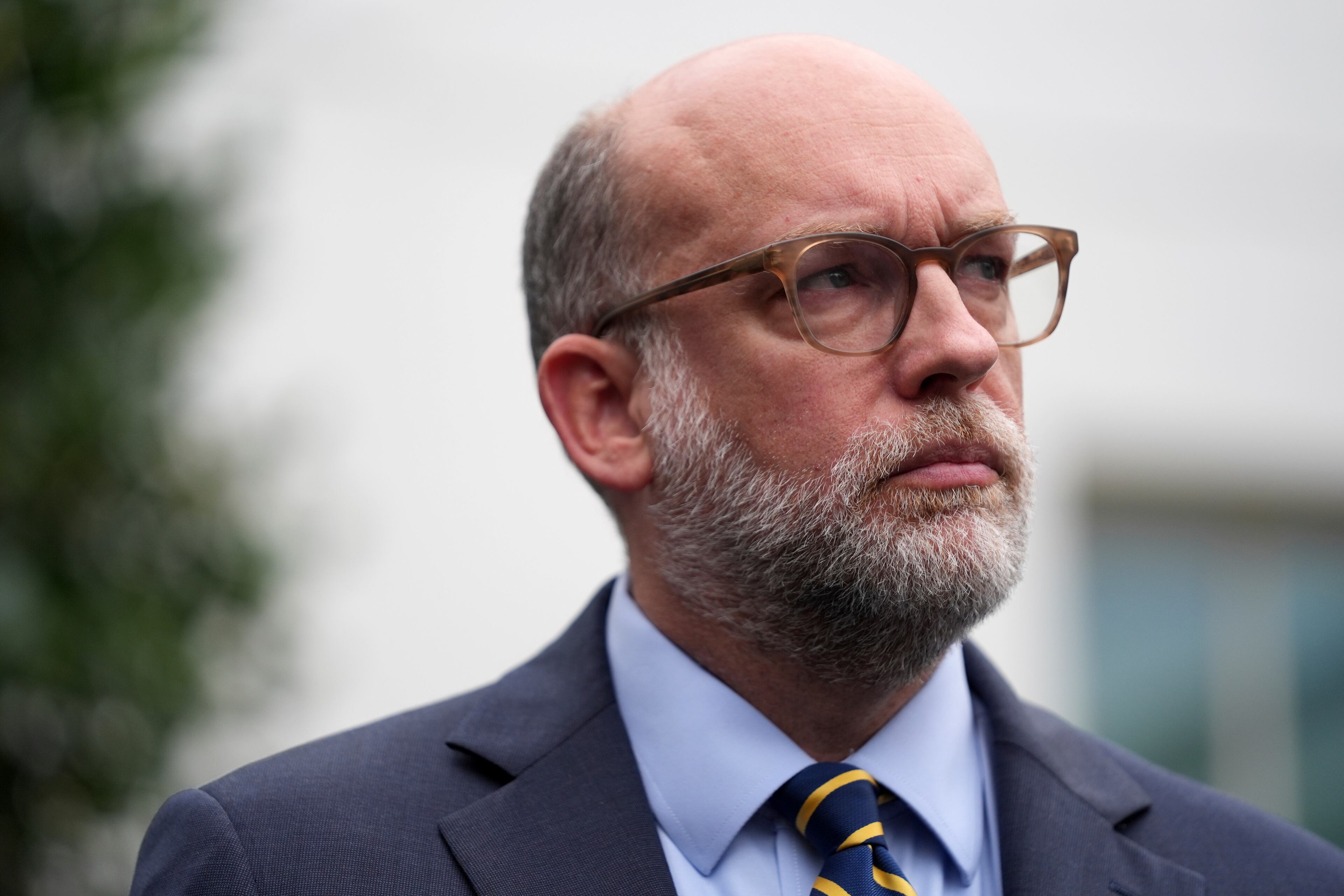 Russell Vought, Office of Management and Budget director, listens as he addresses members of the media outside the West Wing at the White House in Washington, Monday, Sept. 29, 2025, in Washington. (Evan Vucci/AP)