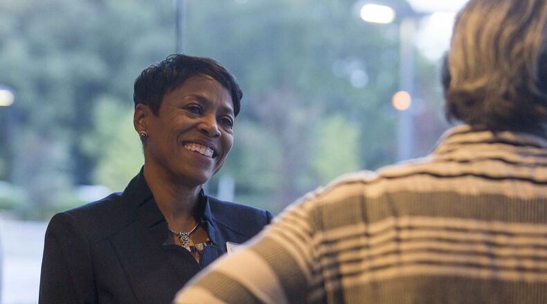 Gwinnett County School Board District 2 candidate Wandy Taylor speaks with someone before a candidate forum on Oct. 16, 2018. (ALYSSA POINTER/ALYSSA.POINTER@AJC.COM)