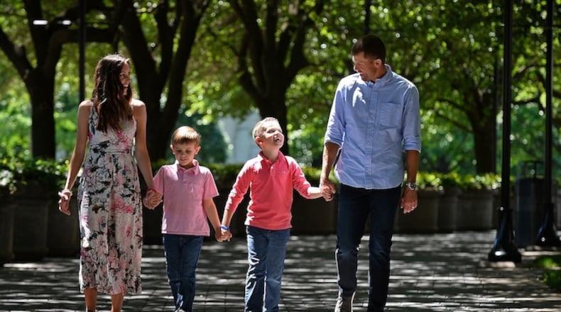 Carolina Panthers punter Andy Lee, right and his wife, Rachel, left, lost their daughter, Madelyn Elizabeth, in 2015, just eight days after she was born in Charlotte. On Wednesday, May 3, 2017 they walked outside Bank of America Stadium with sons, Adam, 5, and Ryan, 7. (Jeff Siner/Charlotte Observer/TNS)