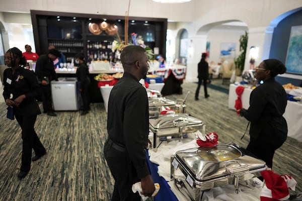Dining room staff prepare for the opening of an Independence Day buffet service, in the independent living community at the Toby and Leon Cooperman Sinai Residences, July 4, 2025, in Boca Raton, Fla. (AP Photo/Rebecca Blackwell)