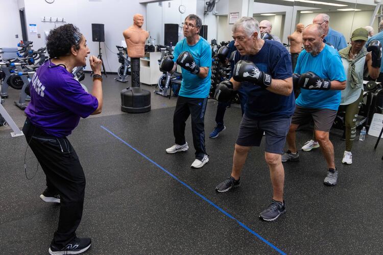 Nausheen Quraishy (left), a Rock Steady Boxing Instructor, teaches a strength training class at the Kennestone Health Place at Kennestone Hospital in Kennesaw, Georgia on July 24, 2024. (Courtesy of Phil Skinner/AJC)
