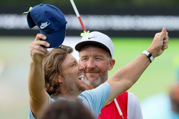 Last year's Tour Championship winner Tommy Fleetwood celebrates at East Lake Golf Club. (Miguel Martinez/ AJC)