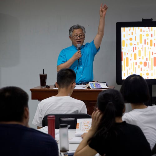 FILE - Pastor Ezra Jin Mingri leads a class on the basics of Christian beliefs at Zion Church in Beijing, Aug. 4, 2018. (AP Photo/Ng Han Guan, File)