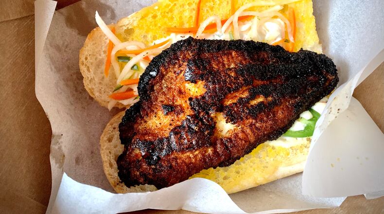 The blackened catfish banh mi is a highlight of the menu at Bon Ton. Henri Hollis/henri.hollis@ajc.com