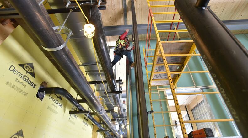 Construction crew working at Atlantic Station early in April. Construction jobs have grown faster than in any other sector. HYOSUB SHIN / HSHIN@AJC.COM