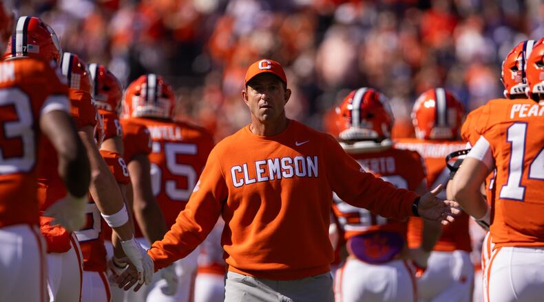 FILE - Clemson head coach Dabo Swinney greets his team before an NCAA college football game against Duke, Nov. 1, 2025, in Clemson, S.C. (AP Photo/Scott Kinser, File)