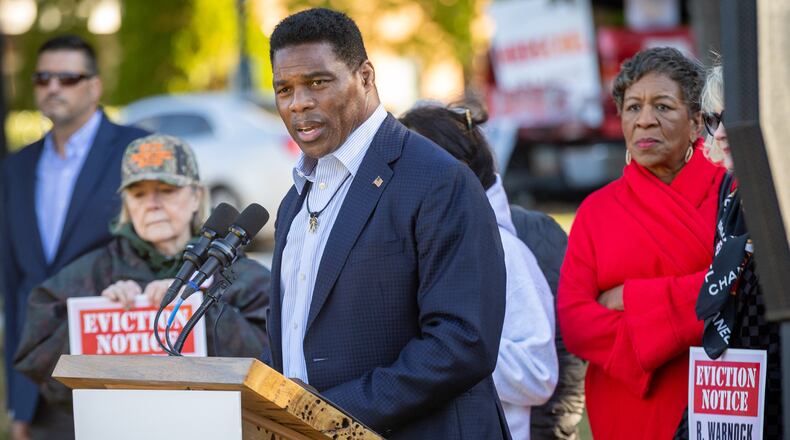 Republican Herschel Walker speaks Tuesday near the Columbia Tower at MLK Village apartments in Atlanta, where he tried to blame Ebenezer Baptist Church and his opponent, Democratic U.S. Sen. Raphael Warnock,, the church's senior pastor, of trying to evict disadvantaged residents. The building is owned by a for-profit entity with ties to Warnock and Ebenezer. A spokesman for the building said no evictions have taken place at there for failure to pay rent since June 2020. Steve Schaefer/steve.schaefer@ajc.com)
