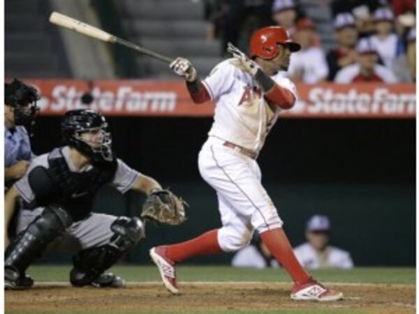 Switch-hitting Erick Aybar will replace Andrelton Simmons at shortstop in 2016 after coming from the Angels along with two top pitching prospect in Thursday's trade for Simmons. (AP photo)
