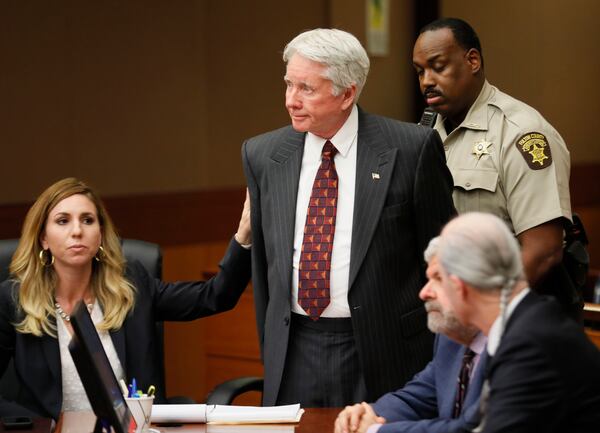 Tex McIver is handcuffed and taken into custody after being found guilty of murder.   Bob Andres bandres@ajc.com