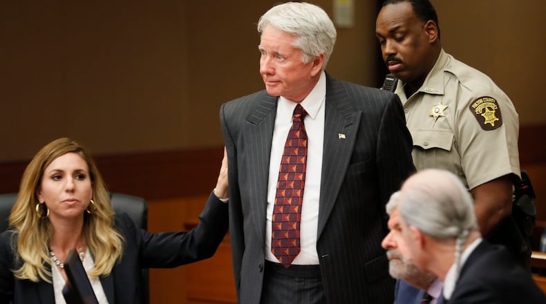 4/23/18 - Atlanta - Standing amidst his attorneys, including Amanda Clark Palmer (left), Tex McIver is handcuffed and taken into custody after the verdict.  The jury found Tex McIver guilty on four of five charges on their fifth day of deliberations today at the Tex McIver murder trial at the Fulton County Courthouse.   Bob Andres bandres@ajc.com