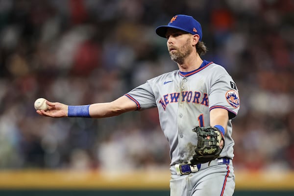 New York Mets second baseman Jeff McNeil throws to first base in the seventh inning of a baseball game against the Atlanta Braves, Thursday, June 19, 2025, in Atlanta. (AP Photo/Colin Hubbard)