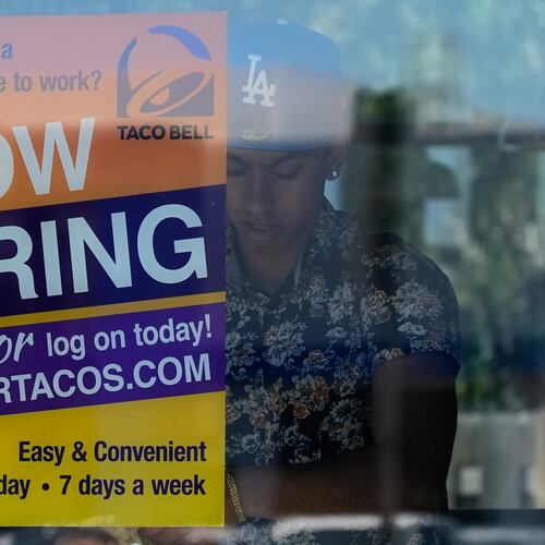 A hiring sign is displayed at a restaurant in Niles, Ill., Thursday, May 14, 2026. (AP Photo/Nam Y. Huh)