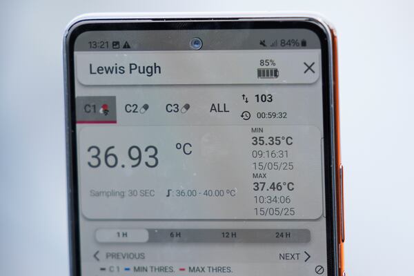 An app is used to monitor endurance swimmer Louis Pugh's temperature while he swims in 47 degree F water, Thursday, May 15, 2025, off Edgartown, Mass. (AP Photo/Robert F. Bukaty)