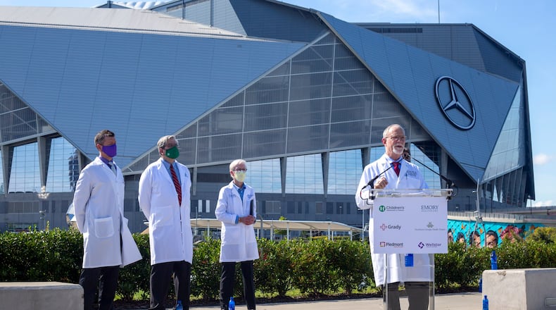 File photo of Dr. Robert Jansen, chief medical officer and chief of staff at Grady Health
System, speaks at a press conference near the Mercedes-Benz Stadium in Atlanta, Georgia in August. (Rebecca Wright for the Atlanta Journal-Constitution)