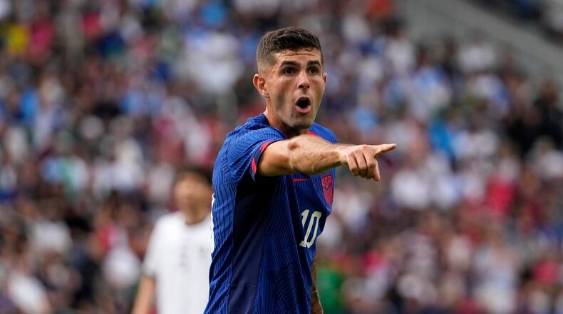 FILE - United States' Christian Pulisic points during the first half of an international friendly soccer match against Uzbekistan Saturday, Sept. 9, 2023, in St. Louis. (AP Photo/Jeff Roberson, File)