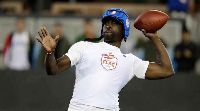 Team Vick's Michael Vick throws against Team Owens during a flag football exhibition game Tuesday, June 27, 2017, in San Jose, Calif. (AP Photo/Marcio Jose Sanchez)