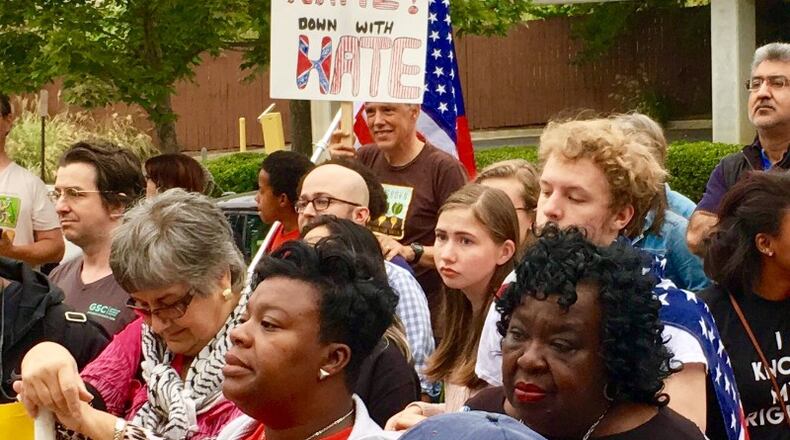 Protestors call for the removal of the obelisk in Decatur Square. file photo by Bill Banks for the AJC