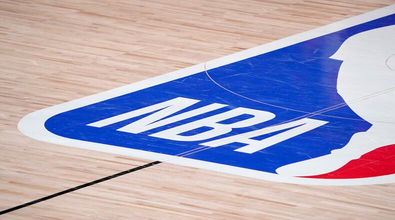 The NBA logo is displayed at center court during an NBA first-round playoff game between the Houston Rockets and Oklahoma City Thunder Sept. 2, 2020, in Lake Buena Vista, Fla. (Mark J. Terrill/AP)