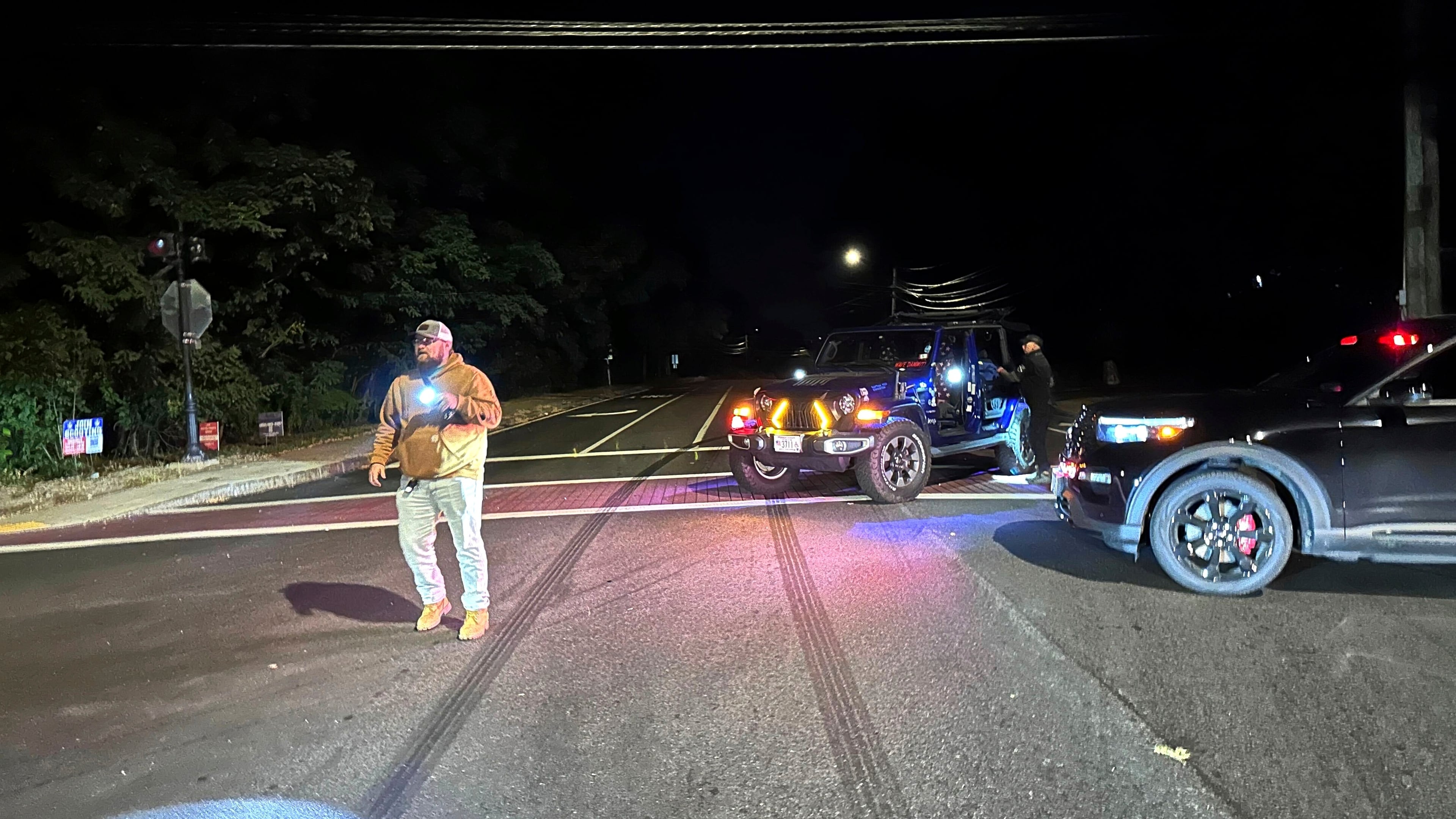 Police block a road to a country club where a shooting happened at Sky Meadow Country Club in Nashua, New Hampshire, Saturday, Sept. 20, 2025. (AP Photo/Michael Casey)