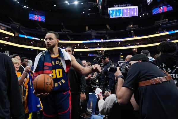 Golden State Warriors guard Stephen Curry (30) walks off the court after the team's victory over the Sacramento Kings in an NBA basketball game Thursday, March 13, 2025, in San Francisco. (AP Photo/Godofredo A. Vásquez)