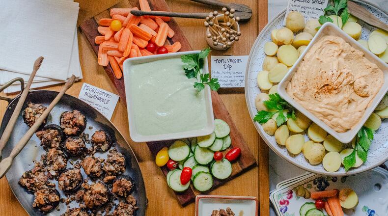 Vegan holiday hors d’oeures satisfy a variety of dietary needs and wants. From left: Pecan Stuffed Mushrooms, Tofu Veggie Dip and Romesco Sauce with Potatoes. (Virginia Willis for The Atlanta Journal-Constitution)