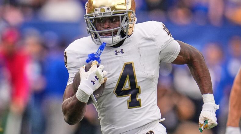 FILE - Notre Dame running back Jeremiyah Love (4) carries the ball during the first half of an NCAA college football game against Pittsburgh in Pittsburgh Saturday, Nov. 15, 2025. (AP Photo/Gene J. Puskar, File)