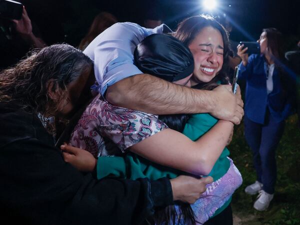 Dalton College student Ximena Arias-Cristobal is embraced by her family after her release from the Stewart Immigration Detention Center, where she was detained for more than two weeks.