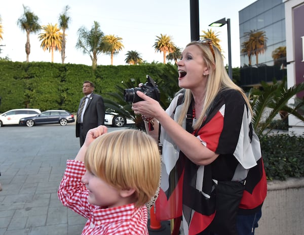  Tricia Hise of Cornelia, Ga., and her son Max, 6, were excited to see the team pull up to the Lawry's Beef Bowl. AJC photo: Hyosub Shin / hshin@ajc.com