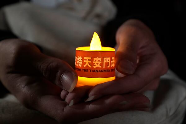 Participants attend a candlelight vigil at Democracy Square to mark the 36th anniversary of the Chinese military crackdown on the pro-democracy movement in Beijing's Tiananmen Square, in Taipei, Taiwan, Wednesday, June 4, 2025. (AP Photo/Chiang Ying-ying)