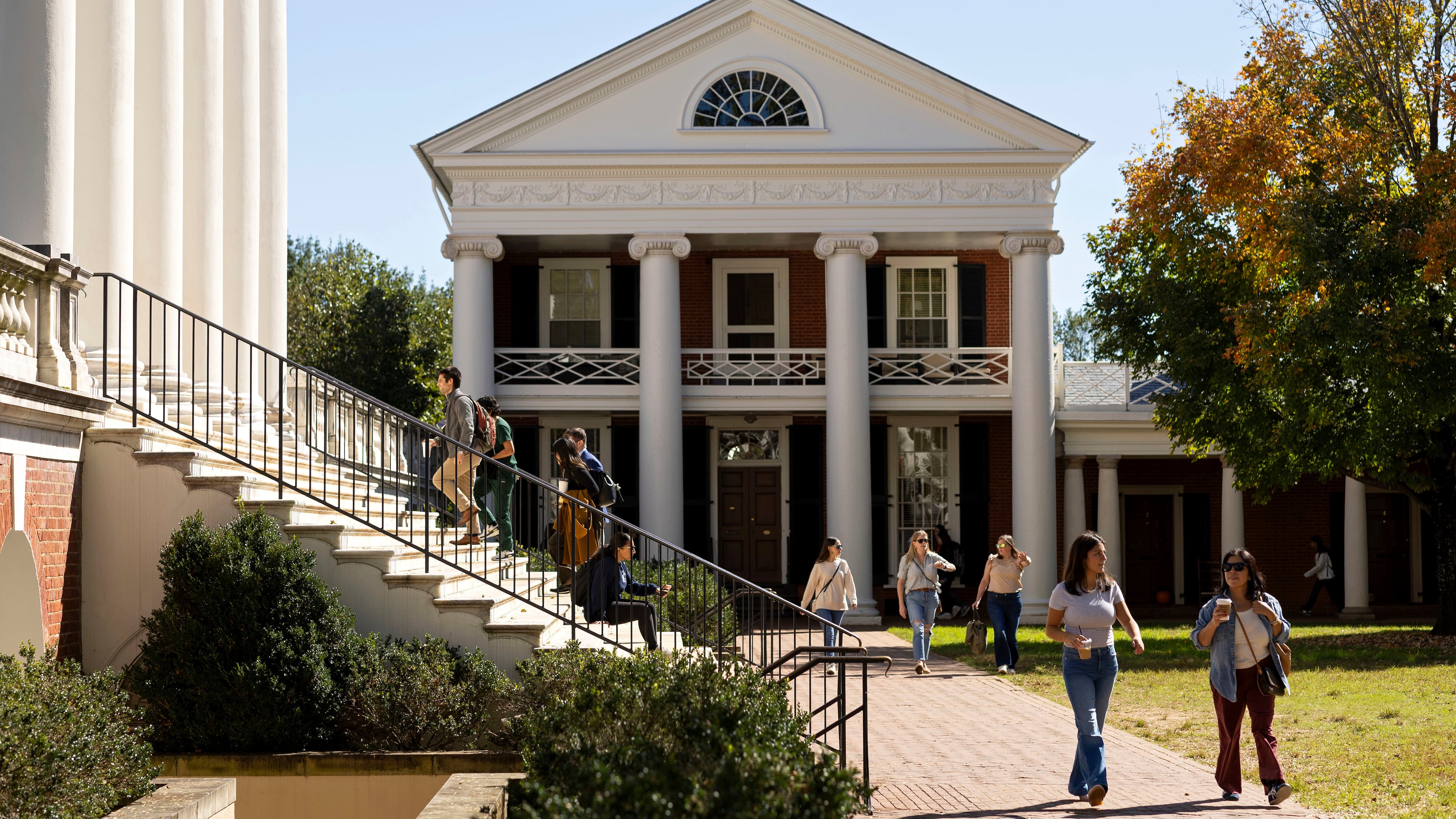 FILE - People climb steps to the Rotunda at the University of Virginia in Charlottesville, Va., Oct. 11, 2024. (AP Photo/Ryan M. Kelly, File)