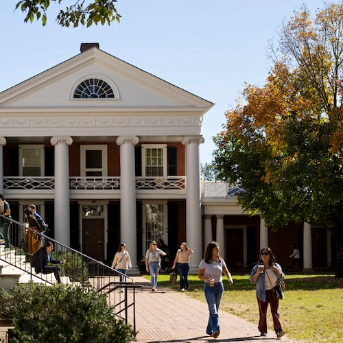 FILE - People climb steps to the Rotunda at the University of Virginia in Charlottesville, Va., Oct. 11, 2024. (AP Photo/Ryan M. Kelly, File)