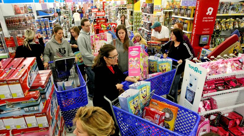 Shoppers in a shopping cart jam looking for 'Door Buster' Christmas deals at Toys "R" Us on Thanksgiving Day in Royal Palm Beach, Fla., Thursday, November 22, 2012. (Gary Coronado/The Palm Beach Post)