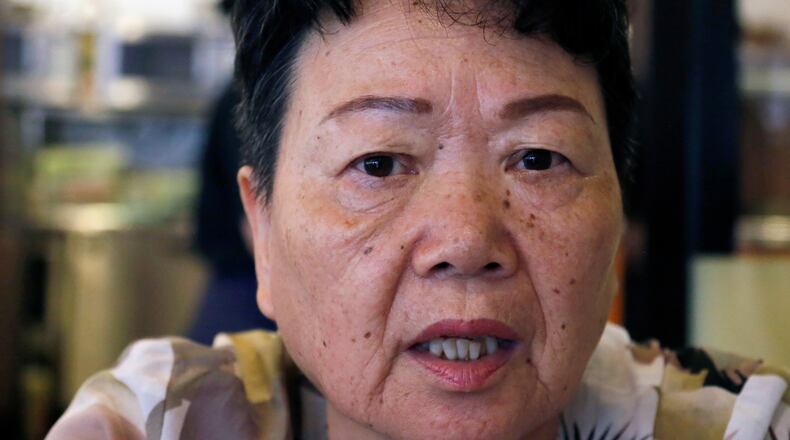 FILE - Eiko Kawasaki, a Korean born in Japan, speaks during an interview in Tokyo Friday, Aug. 24, 2018. (AP Photo/Yuri Kageyama, file)