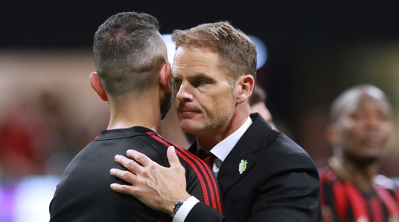 Atlanta United head coach Frank de Boer hugs midfielder Justin Meram after falling 2-1 to Toronto FC in the Eastern Conference Final on Wednesday, October 30, 2019, in Atlanta. Curtis Compton/ccompton@ajc.com