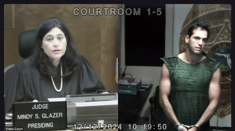 FILE - In this screenshot, Miami Dade Circuit Court Judge Mindy S. Glazer is seen via video presiding over the first court appearance of Alon Alexander, who is charged with sexual battery along with his twin brother, Oren Alexander, on Thursday, Dec. 12, 2024, in Miami. (Miami Dade Circuit Court via AP, Pool, File)