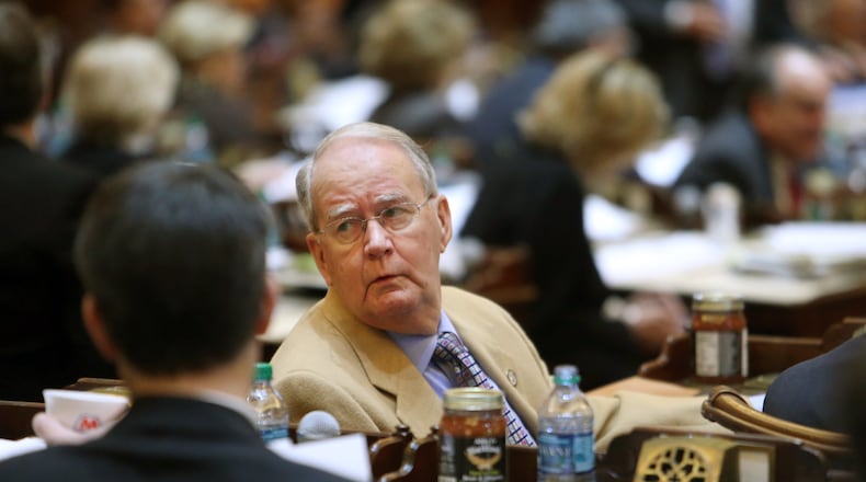 February 20, 2013 - Atlanta, Ga: Rep. Mickey Channell, R-Greensboro, talks with fellow Representatives at his desk during Legislative Day 20 in the House chambers Wednesday morning in Atlanta, Ga., February 20, 2013. Last year, Channell pushed through a bill making Delta's tax credits permanent. JASON GETZ / JGETZ@AJC.COM