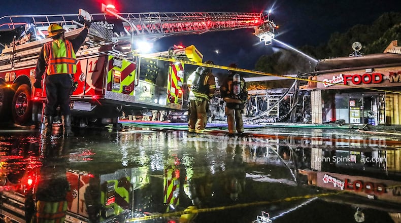 The fire destroyed three businesses at the Colony Village strip mall on South Norcross Tucker Road.