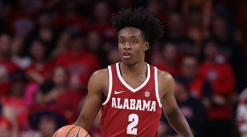 TUCSON, AZ - DECEMBER 09:  Collin Sexton #2 of the Alabama Crimson Tide handles the ball during the first half of the college basketball game against the Arizona Wildcats at McKale Center on December 9, 2017 in Tucson, Arizona. The Wildcats defeated the Crimson Tide 88-82.  (Photo by Christian Petersen/Getty Images)