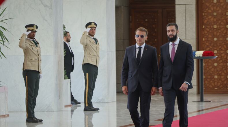 Syrian President Ahmad al-Sharaa, right, meets French President Emmanuel Macron at the presidential palace in Damascus, Syria, Tuesday, July 7, 2026. (AP Photo/Ghaith Alsayed)