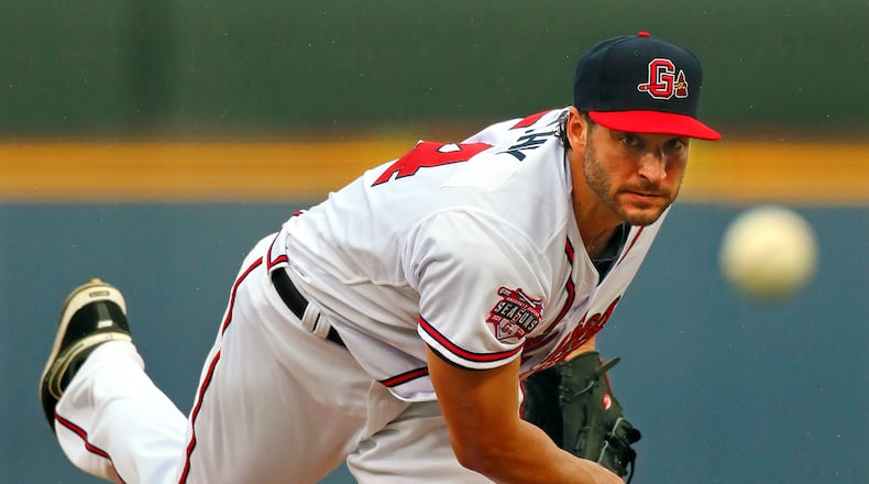 Braves pitcher Brandon Beachy, making a rehab start with the Gwinnett Braves, delivers a pitch against the Norfolk Tides during the frist inning at Coolray Field on Tuesday, July 9, 2013, in Lawrenceville.