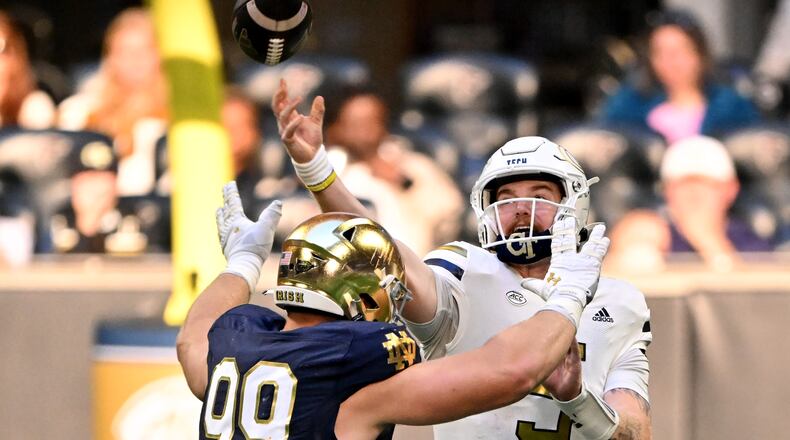 Georgia Tech quarterback Zach Pyron (5) gets off a pass under pressure from Notre Dame defensive lineman Rylie Mills (99) during the second half in an NCAA football game at Mercedes-Benz Stadium, Saturday, October 19, 2024, in Atlanta. Notre Dame won 31-13 over Georgia Tech. (Hyosub Shin / AJC)