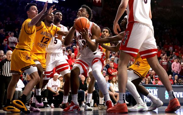 Arizona forward Tobe Awaka (30) tries to get off a put-back in a crowded lane against Arizona State during an NCAA college basketball game in Tucson, Ariz., March 4, 2025. (Kelly Presnell/Arizona Daily Star via AP)