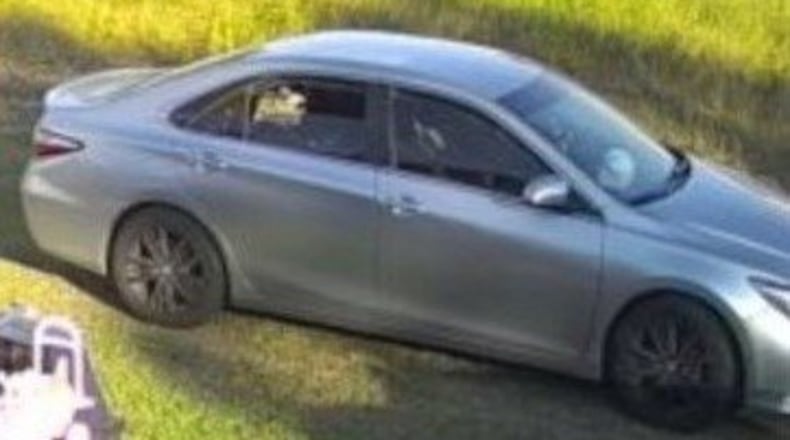 Douglasville police released a photo of a silver Toyota Camry in which they believe two people fled the scene of a deadly shooting in a Kroger parking lot.