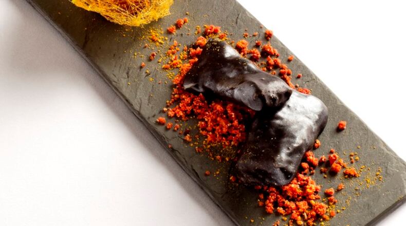 In an undated handout photo, the Spanish- style Ametsa Afternoon Tea with chocolate churros at the Halkin. The spread was created by the Michelin-starred chef Sergio Sanz Blanco and is part of a growing trend of properties that are doing away with the predictability of afternoon tea by offering creative interpretations of the classic pastime.