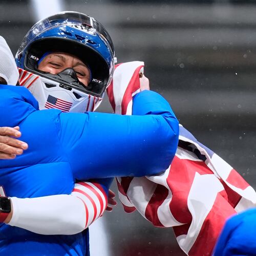 United States' gold medalist Elana Meyers Taylor celebrates at the finish after the women's monobob competition at the 2026 Winter Olympics, in Cortina d'Ampezzo, Italy, Monday, Feb. 16, 2026.(AP Photo/Aijaz Rahi)