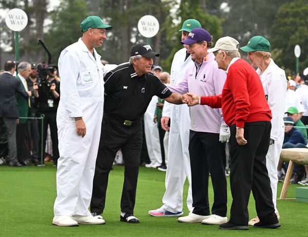 Honorary starters (from left) Gary Player, Tom Watson and Jack Nicklaus with their caddies greet each other after their ceremonial tee shots to begin the Masters at Augusta National Golf Club, Thursday, April 6, 2023, in Augusta, Ga. (Hyosub Shin / Hyosub.Shin@ajc.com)